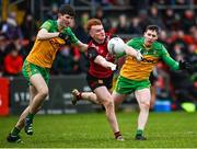 8 January 2023; Danny Magill of Down in action against Johnny McGroddy and Jamie Brennan of Donegal during the Bank of Ireland Dr McKenna Cup Round 2 match between Down and Donegal at Pairc Esler in Newry, Down. Photo by Harry Murphy/Sportsfile