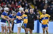 8 January 2023; Referee Eamonn Stapleton shows a black card to Bryan O'Mara of Tipperary, third from left, during the Co-Op Superstores Munster Hurling League Group 1 match between Tipperary and Clare at McDonagh Park in Nenagh, Tipperary. Photo by Sam Barnes/Sportsfile