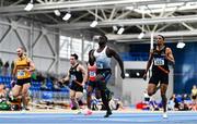 8 January 2023; Israel Olatunde of UCD AC, Dublin, centre, on his way to winning the Men's Senior 60m during the Athletics Ireland National League Round 1 at Sport Ireland National Indoor Arena in Dublin. Photo by Ben McShane/Sportsfile