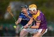 8 January 2023; Ian Carty of Wexford in action against Aaron Dunphy of Laois during the Walsh Cup Group 2 Round 1 match between Laois and Wexford at St Fintan's GAA Grounds in Mountrath, Laois. Photo by Seb Daly/Sportsfile