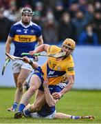 8 January 2023; David Conroy of Clare is fouled by Bryan O'Mara of Tipperary, resulting in a penalty during the Co-Op Superstores Munster Hurling League Group 1 match between Tipperary and Clare at McDonagh Park in Nenagh, Tipperary. Photo by Sam Barnes/Sportsfile