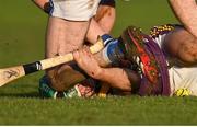 8 January 2023; Kyle Firman of Wexford tussles with Patrick Purcell of Laois during the Walsh Cup Group 2 Round 1 match between Laois and Wexford at St Fintan's GAA Grounds in Mountrath, Laois. Photo by Seb Daly/Sportsfile