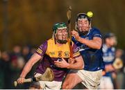 8 January 2023; Kyle Firman of Wexford in action against Donnchadh Hartnett of Laois during the Walsh Cup Group 2 Round 1 match between Laois and Wexford at St Fintan's GAA Grounds in Mountrath, Laois. Photo by Seb Daly/Sportsfile