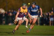 8 January 2023; Kyle Firman of Wexford in action against Donnchadh Hartnett of Laois during the Walsh Cup Group 2 Round 1 match between Laois and Wexford at St Fintan's GAA Grounds in Mountrath, Laois. Photo by Seb Daly/Sportsfile