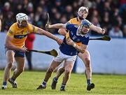 8 January 2023; Alan Tynan of Tipperary in action against Conor Cleary, left, and Brandon O'Connell of Clare during the Co-Op Superstores Munster Hurling League Group 1 match between Tipperary and Clare at McDonagh Park in Nenagh, Tipperary. Photo by Sam Barnes/Sportsfile