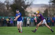8 January 2023; Aaron Dunphy of Laois in action against Ian Carty of Wexford during the Walsh Cup Group 2 Round 1 match between Laois and Wexford at St Fintan's GAA Grounds in Mountrath, Laois. Photo by Seb Daly/Sportsfile