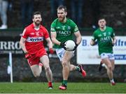 8 January 2023; Ultan Kelm of Fermanagh in action against Niall Loughlin of Derry during the Bank of Ireland Dr McKenna Cup Round 2 match between Fermanagh and Derry at Ederney St Josephs GAA Club in Ederney, Fermanagh. Photo by Oliver McVeigh/Sportsfile