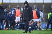8 January 2023; Kerry County Board secretary Peter Twiss carries bags of equipment from the dugouts to the dressing rooms after the McGrath Cup Group A match between Kerry and Clare at Austin Stack Park in Tralee, Kerry. Photo by Brendan Moran/Sportsfile