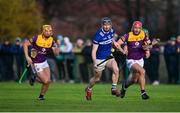 8 January 2023; Aaron Dunphy of Laois in action against Conor Hearne of Wexford, right, during the Walsh Cup Group 2 Round 1 match between Laois and Wexford at St Fintan's GAA Grounds in Mountrath, Laois. Photo by Seb Daly/Sportsfile