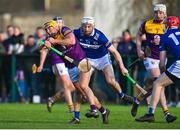 8 January 2023; Damien Reck of Wexford in action against Martin Phelan of Laois during the Walsh Cup Group 2 Round 1 match between Laois and Wexford at St Fintan's GAA Grounds in Mountrath, Laois. Photo by Seb Daly/Sportsfile