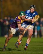 8 January 2023; Kyle Firman of Wexford in action against Donnchadh Hartnett of Laois during the Walsh Cup Group 2 Round 1 match between Laois and Wexford at St Fintan's GAA Grounds in Mountrath, Laois. Photo by Seb Daly/Sportsfile