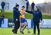 8 January 2023; Séadna Morey of Clare is consoled by selector Ken Ralph, right, after picking up an injury during the Co-Op Superstores Munster Hurling League Group 1 match between Tipperary and Clare at McDonagh Park in Nenagh, Tipperary. Photo by Sam Barnes/Sportsfile