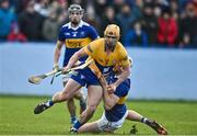8 January 2023; David Conroy of Clare is fouled by Bryan O'Mara of Tipperary, resulting in a penalty during the Co-Op Superstores Munster Hurling League Group 1 match between Tipperary and Clare at McDonagh Park in Nenagh, Tipperary. Photo by Sam Barnes/Sportsfile