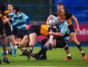 10 January 2023; Scott Doran of Newpark Comprehensive School is tackled by Andrew McAdams of Newpark Comprehensive School during the Bank of Ireland Vinnie Murray Cup First Round match between The King's Hospital and Newpark Comprehensive School at Energia Park in Dublin. Photo by Tyler Miller/Sportsfile