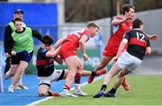 10 January 2023; Sean Byrne of CUS is tackled by Milo Lavelle of The High School during the Bank of Ireland Vinnie Murray Cup First Round match between The High School and CUS at Energia Park in Dublin. Photo by Tyler Miller/Sportsfile
