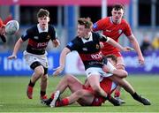 10 January 2023; Andrew Farrelly of The High School is tackled by Hugh Quigley of CUS during the Bank of Ireland Vinnie Murray Cup First Round match between The High School and CUS at Energia Park in Dublin. Photo by Tyler Miller/Sportsfile