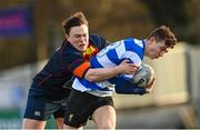 11 January 2023; Ross Harris of Ardscoil na Tríonóide is tackled by Rhys Gamble of Temple Carrig during the Bank of Ireland Vinnie Murray Cup first round match between Ardscoil na Tríonóide and Temple Carrig School at Energia Park in Dublin. Photo by Harry Murphy/Sportsfile