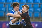 11 January 2023; Andrew Doyle of Ardscoil na Tríonóide is tackled by Sam Farrar of Temple Carrig during the Bank of Ireland Vinnie Murray Cup first round match between Ardscoil na Tríonóide and Temple Carrig School at Energia Park in Dublin. Photo by Harry Murphy/Sportsfile