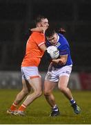 11 January 2023; Dara McVeety of Cavan is tackled by Callum Cumisky of Armagh during the Bank of Ireland Dr McKenna Cup Round 3 match between Cavan and Armagh at Kingspan Breffni in Cavan. Photo by Eóin Noonan/Sportsfile