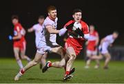 11 January 2023; Padraig McGrogan of Derry in action against Cathal McShane of Tyrone during the Bank of Ireland Dr McKenna Cup Round 3 match between Derry and Tyrone at Derry GAA Centre of Excellence in Owenbeg, Derry. Photo by Ben McShane/Sportsfile