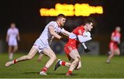 11 January 2023; Padraig McGrogan of Derry in action against Cathal McShane of Tyrone during the Bank of Ireland Dr McKenna Cup Round 3 match between Derry and Tyrone at Derry GAA Centre of Excellence in Owenbeg, Derry. Photo by Ben McShane/Sportsfile