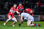 11 January 2023; Brian Kennedy of Tyrone is tackled by Gareth McKinless, left, and Brendan Rogers of Derry during the Bank of Ireland Dr McKenna Cup Round 3 match between Derry and Tyrone at Derry GAA Centre of Excellence in Owenbeg, Derry. Photo by Ben McShane/Sportsfile