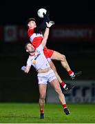 11 January 2023; Conor Doherty of Derry and Niall Sludden of Tyrone contest a high ball during the Bank of Ireland Dr McKenna Cup Round 3 match between Derry and Tyrone at Derry GAA Centre of Excellence in Owenbeg, Derry. Photo by Ben McShane/Sportsfile