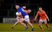 11 January 2023; Dara McVeety of Cavan is tackled by Callum Cumisky of Armagh during the Bank of Ireland Dr McKenna Cup Round 3 match between Cavan and Armagh at Kingspan Breffni in Cavan. Photo by Eóin Noonan/Sportsfile