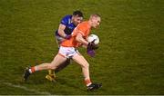11 January 2023; Cian McConville of Armagh is tackled by Conor Moynagh of Cavan during the Bank of Ireland Dr McKenna Cup Round 3 match between Cavan and Armagh at Kingspan Breffni in Cavan. Photo by Eóin Noonan/Sportsfile