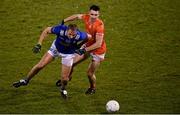 11 January 2023; David Brady of Cavan is tackled by Shane McPartland of Armagh during the Bank of Ireland Dr McKenna Cup Round 3 match between Cavan and Armagh at Kingspan Breffni in Cavan. Photo by Eóin Noonan/Sportsfile