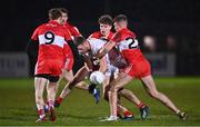 11 January 2023; Brian Kennedy of Tyrone in action against Derry players, from left, Brendan Rogers, Eoin McEvoy and Oisin McWilliams during the Bank of Ireland Dr McKenna Cup Round 3 match between Derry and Tyrone at Derry GAA Centre of Excellence in Owenbeg, Derry. Photo by Ben McShane/Sportsfile