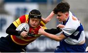 12 January 2023; Ben Griffiths of Temple Carrig School is tackled by Edward Lawlor of St Andrew's College during the Bank of Ireland Fr Godfrey Cup First Round match between St Andrew's College and Temple Carrig School at Energia Park in Dublin. Photo by Harry Murphy/Sportsfile