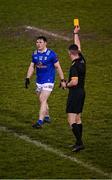 11 January 2023; Ryan O'Neill of Cavan is shown a yellow card by referee Diarmuid Boylan during the Bank of Ireland Dr McKenna Cup Round 3 match between Cavan and Armagh at Kingspan Breffni in Cavan. Photo by Eóin Noonan/Sportsfile