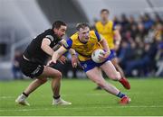 13 January 2023; Paul Carey of Roscommon in action against Paul Kilcoyne of Sligo during the Connacht FBD League Semi-Final match between Sligo and Roscommon at NUI Galway Connacht GAA Air Dome in Bekan, Mayo. Photo by Piaras Ó Mídheach/Sportsfile