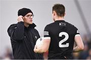 13 January 2023; Sligo manager Tony McEntee speaks with Luke Nicholson of Sligo before the Connacht FBD League Semi-Final match between Sligo and Roscommon at NUI Galway Connacht GAA Air Dome in Bekan, Mayo. Photo by Piaras Ó Mídheach/Sportsfile