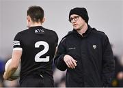 13 January 2023; Sligo manager Tony McEntee speaks with Luke Nicholson of Sligo before the Connacht FBD League Semi-Final match between Sligo and Roscommon at NUI Galway Connacht GAA Air Dome in Bekan, Mayo. Photo by Piaras Ó Mídheach/Sportsfile