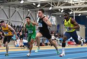 14 January 2023; Oliver Swinney of Speed Development Project Track AC, second from right, on his way to winning the under 23 men's 60m ahead of Bori Akinola of UCD AC, Dublin, right, who finished second, during the 123.ie National Junior and U23 Indoor Athletics Championships at the National Indoor Arena in Dublin. Photo by Sam Barnes/Sportsfile