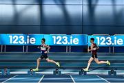 14 January 2023; Sean McGinley of Finn Valley AC, Donegal, left, on his way to winning the under 23 men's 1500m during the 123.ie National Junior and U23 Indoor Athletics Championships at the National Indoor Arena in Dublin. Photo by Sam Barnes/Sportsfile