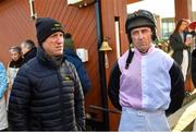14 January 2023; Jockey Davy Russell, right, and former jockey Robbie Power before the Phillip O'Connor Memorial hurdle at Fairyhouse Racecourse in Meath. Photo by David Fitzgerald/Sportsfile