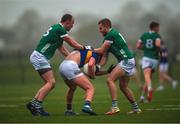 14 January 2023; Cathal Deeley of Tipperary is tackled by Robbie Bourke of Limerick, left, and Gordon Brown of Limerick during the McGrath Cup Group B match between between Tipperary and Limerick at Fethard Community Astroturf Pitch, Fethard in Tipperary. Photo by Tom Beary/Sportsfile