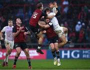14 January 2023; James Ramm of Northampton Saints, right, battles for possession against Mike Haley, left, and Jack Crowley of Munster during the Heineken Champions Cup Pool B Round 3 match between Munster and Northampton Saints at Thomond Park in Limerick. Photo by Tyler Miller/Sportsfile