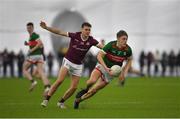 14 January 2023; Donnacha McHugh of Mayo in action against Robert Finnerty of Galway during the Connacht FBD League Semi-Final match between Mayo and Galway at NUI Galway Connacht GAA Air Dome in Bekan, Mayo. Photo by Ray Ryan/Sportsfile