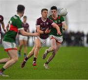 14 January 2023; Dylan McHugh of Galway in action against Bob Tuohy of Mayo during the Connacht FBD League Semi-Final match between Mayo and Galway at NUI Galway Connacht GAA Air Dome in Bekan, Mayo. Photo by Ray Ryan/Sportsfile