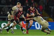 14 January 2023; Niall Scannell of Munster is tackled by Lewis Ludlam of Northampton Saints during the Heineken Champions Cup Pool B Round 3 match between Munster and Northampton Saints at Thomond Park in Limerick. Photo by Brendan Moran/Sportsfile