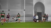 14 January 2023; Paul Towey of Mayo scores his side's first goal past Galway goalkeeper Bernie Power during the Connacht FBD League Semi-Final match between Mayo and Galway at NUI Galway Connacht GAA Air Dome in Bekan, Mayo. Photo by Ray Ryan/Sportsfile