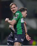 14 January 2023; Conor Oliver of Connacht celebrates with teammate John Porch, left, after scoring their side's seventh try during the EPCR Challenge Cup Pool A Round 3 match between Connacht and CA Brive at The Sportsground in Galway. Photo by Ben McShane/Sportsfile