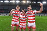14 January 2023; Ballygiblin players, from left, Mark Keane, Killian Roche and Michael Lewis celebrate after their side's victory in the AIB GAA Hurling All-Ireland Junior Championship Final match between Ballygiblin of Cork and Easkey of Sligo at Croke Park in Dublin. Photo by Piaras Ó Mídheach/Sportsfile