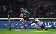 14 January 2023; Conor Fitzgerald of Connacht runs in to scores his side's eigth try despite the tackle of Matthieu Voisin of CA Brive during the EPCR Challenge Cup Pool A Round 3 match between Connacht and CA Brive at The Sportsground in Galway. Photo by Ben McShane/Sportsfile