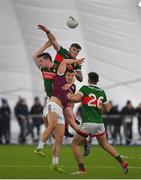 14 January 2023; Damien Comer of Galway in action against Jordan Flynn and Stephen Coen of Mayo during the Connacht FBD League Semi-Final match between Mayo and Galway at NUI Galway Connacht GAA Air Dome in Bekan, Mayo. Photo by Ray Ryan/Sportsfile