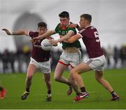 14 January 2023; Bob Tuohy of Mayo in action against Johnny Heaney and Dylan McHugh of Galway during the Connacht FBD League Semi-Final match between Mayo and Galway at NUI Galway Connacht GAA Air Dome in Bekan, Mayo. Photo by Ray Ryan/Sportsfile